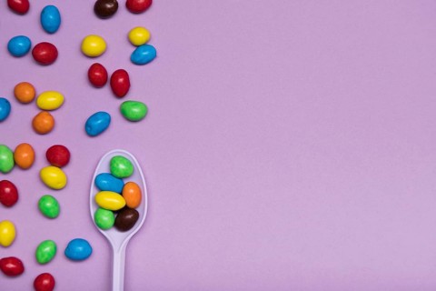 Flat lay frame with candy spoon