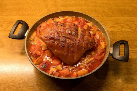 Finished roast pork in a roasting pan
