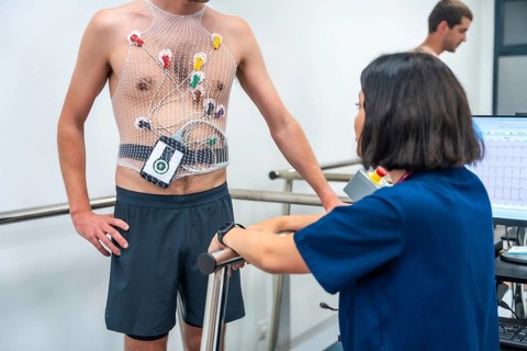 Cardiologist and doctor talking after performing a cardiovascular stress test in a clinic