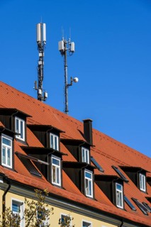 Rores tiled roof with dormers and antennas