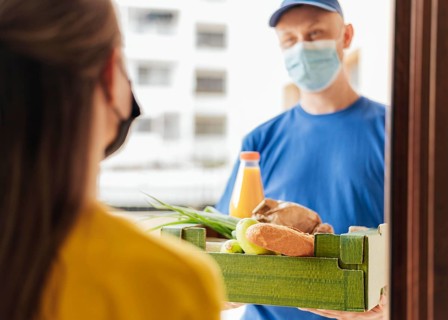 Close up man delivering food