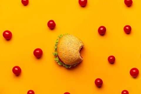 Flat lay burger with cherry tomatoes