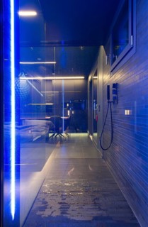 Modern Luxury Bathroom with Beautiful Design with View to Kitchen in Apartment in Switzerland