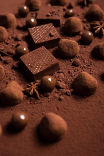 Close up chocolate waffles truffles cocoa powder