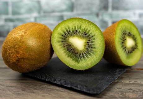 Fresh kiwis sliced on a plate