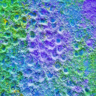Close up purple green holi color powder backdrop