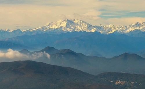 Aerial View over a Beautiful Mountainscape and And Snow Capped Monte Rosa and Mountain Peak Matterhorn and with Floating Clouds in a Sunny Day in Ticino