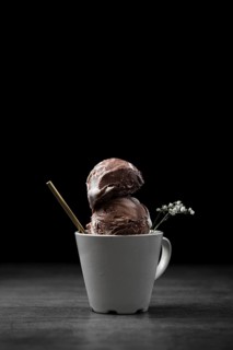 Cup with chocolate ice cream scoops