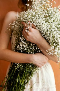 Front view woman holding bouquet flowers