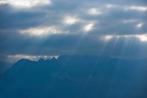 Rays of sunshine break through the clouds on Lake Geneva in Vevey