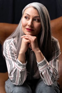 Beautiful senior woman portrait posing chair 2