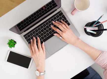 Flat lay woman working laptop