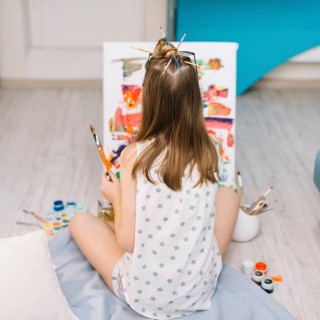 Girl white sitting floor painting with gouache