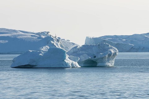 Icebergs in the UNESCO World Heritage Ilulissat Icefjord in the evening sun. Disko Bay