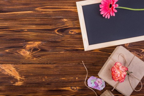 Frame blackboard decorated flowers present box