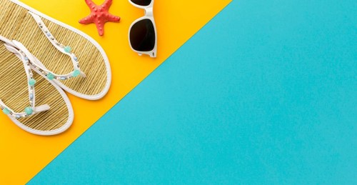 Top view summer slippers with sunglasses