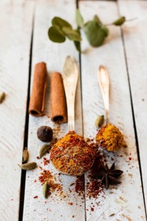 Cinnamon sticks spoon with indian spices