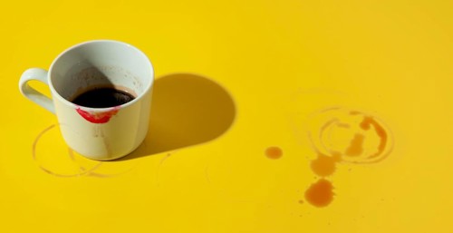 Cup coffee stained with lipstick