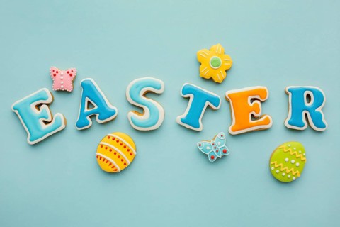 Flat lay easter eggs with flower butterfly shapes