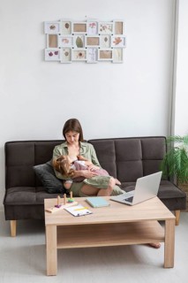 Full shot mother breastfeeding girl