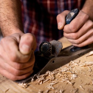 Close up man working with wood 3