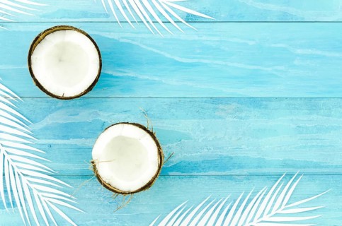 Coconuts with palm leaves wooden table