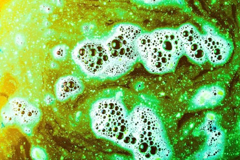Abstract green bath bomb water with bubbles