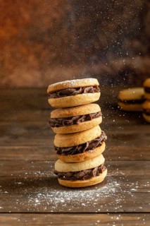 Biscuits with cream wooden table