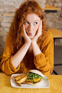 Medium shot woman with delicious food