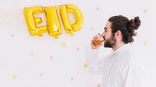 Eid al fitr concept with man drinking tea
