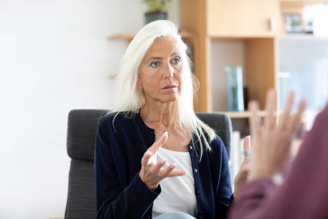 Therapist talking to a patient in a practice
