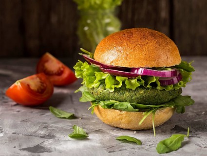 Front view vegetarian burger counter with tomatoes