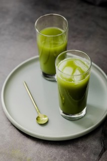High angle matcha tea glasses with ice cubes