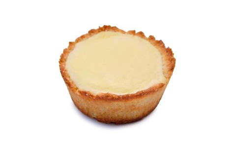 High angle view of vanilla cake with no topping isolated on white background