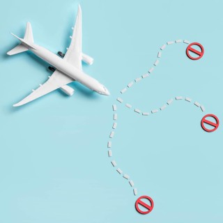 Flat lay plane toy blue background