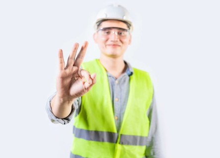 Young engineer counting number three isolated. Male engineer showing number three with fingers isolated