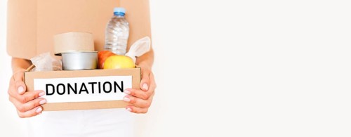 Front view person holding box food donation