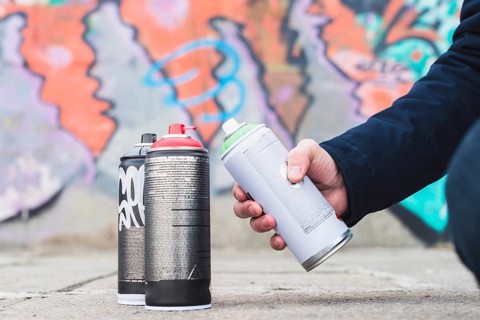 Close up man s hand holding spray bottle