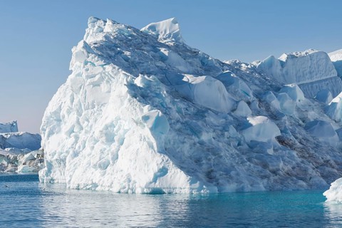 Huge iceberg in the UNESCO World Heritage Ilulissat Icefjord seen from a boat. Ilulissat