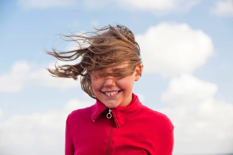 Portrait of a young girl in the wind