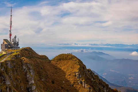 Aerial View over a Beautiful Meteorological and Communication Station on Mountain Peak and Mountainscape in a Sunny Day in Monte Generoso