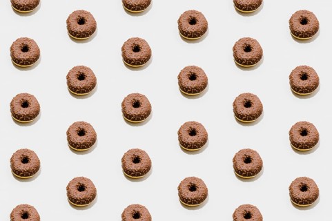 Bakery pattern with chocolate donuts