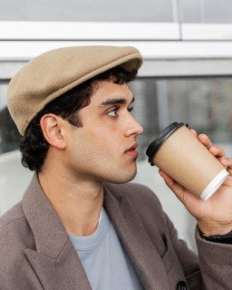 Close up man drinking coffee
