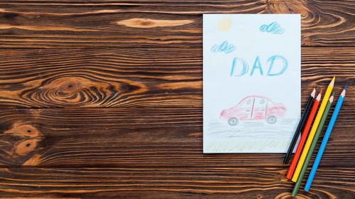 Dad inscription with car drawing paper sheet