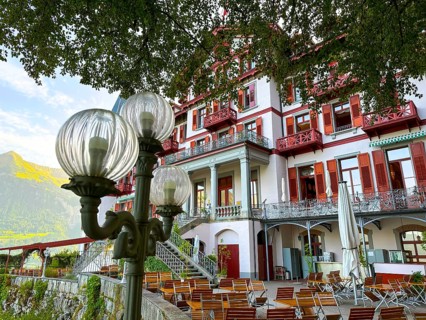 Grandhotel Giessbach with Terrace and Street Lamp in a Sunny Summer Day in Brienz