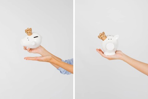 Crop hands with piggy bank