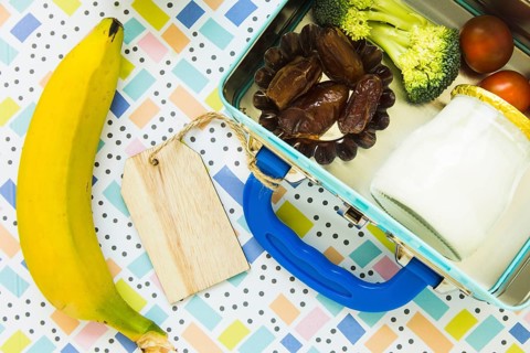 Banana lying near lunchbox