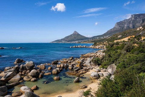 Atlantic Ocean with Lion's head and Table Mountain from Llandudno beachCape Town