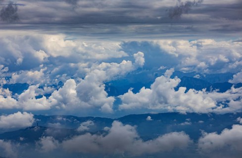 Dramatic cloudy sky on the Gerlitzen with a view of the Klagenfurt basin with the Pyramidenkogel observation tower