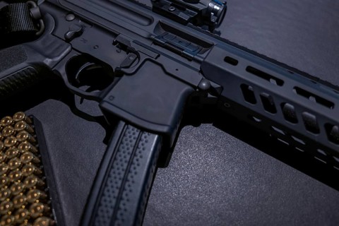 Modern Elegant Assault Rifle and Bullet on Grey Background in Switzerland